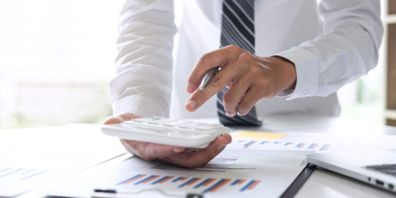 Businessman accountant working analyzing and calculating expense